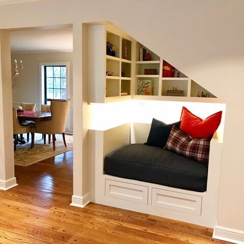 Interior Renovation Spring, TX - Reading nook added under stairway with under cabinet lighting and built-in shelving
