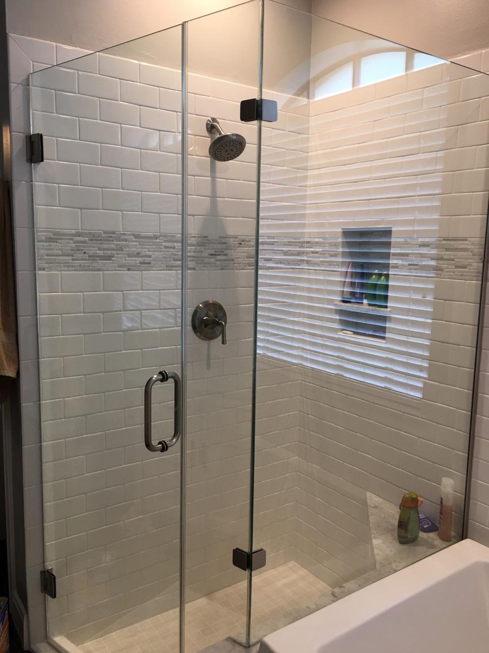 Frame-less glass shower. Custom vanities, tile flooring, drop-in tub, and paint