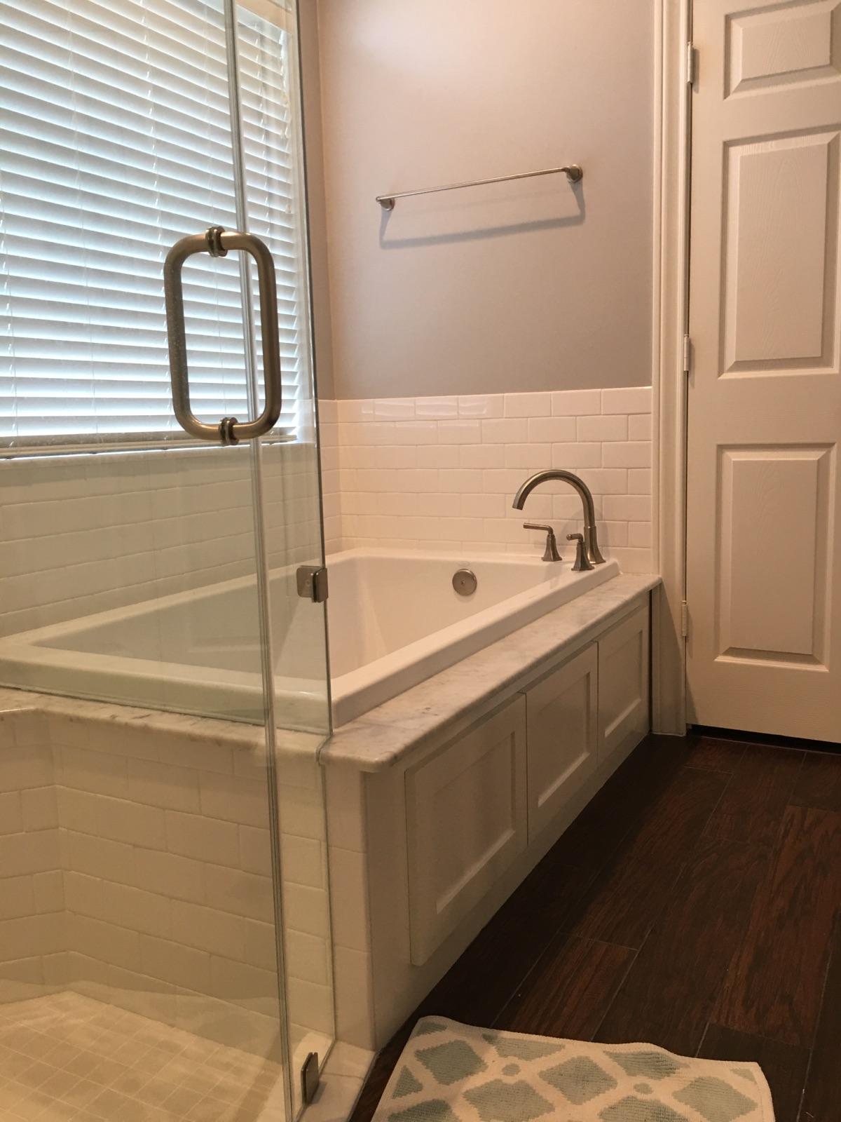 Master Bath remodel in Spring - Drop-in tub with tile backsplash, frame-less glass shower, and tile flooring. Custom vanities, new plumbing, and paint
