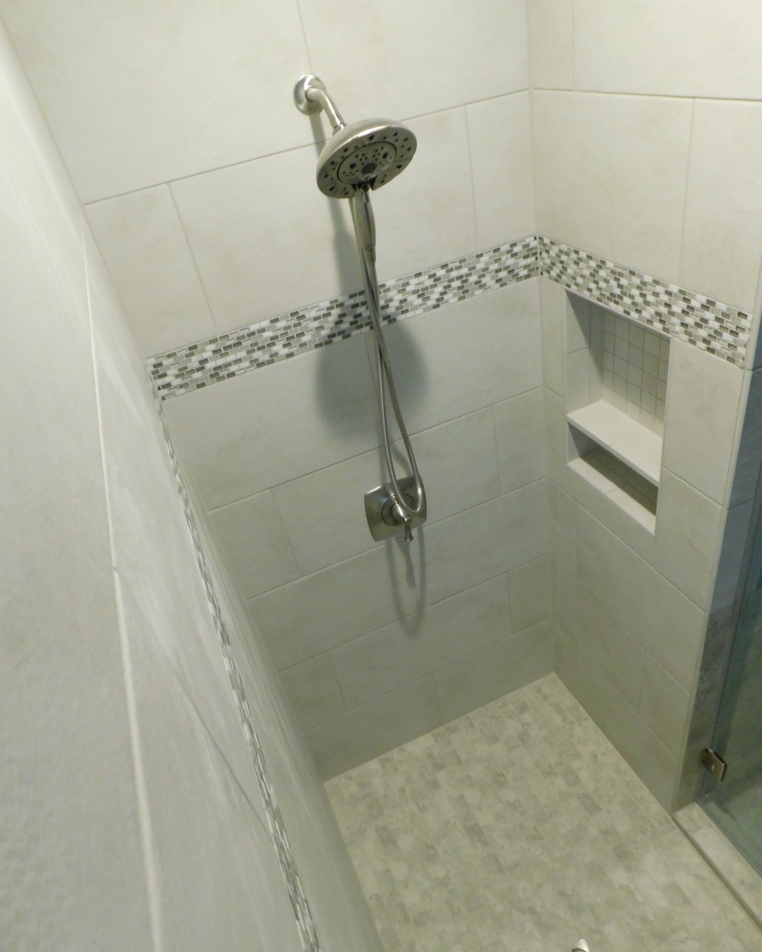 Master Bath Renovation (Shower) - Ariel view of remodeled shower with corner bench (not pictured), soap niche, and tile deco line