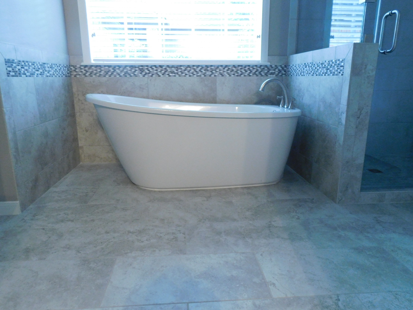 Master Bath Renovation in Spring (Freestanding Tub) - New freestanding tub, deck mounted faucet, tile backsplash, and flooring