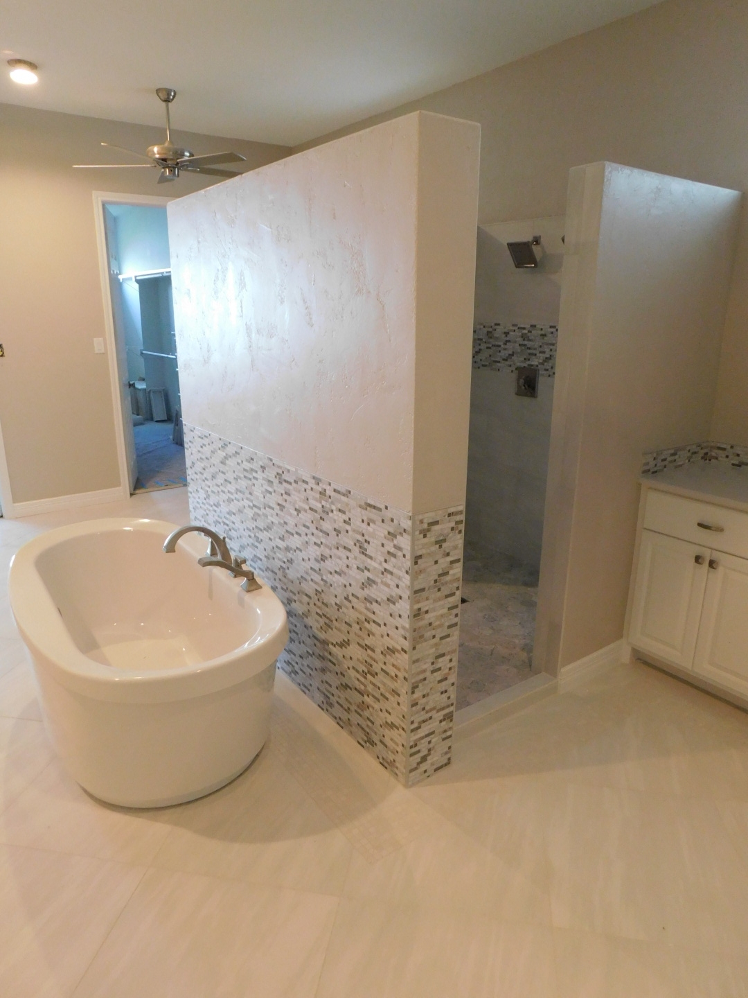Master Bath &amp; Kitchen Remodel Conroe - Reconfigured the Master Bath: Added new His/Her vanities, freestanding tub and wall for open air shower, and heated floors