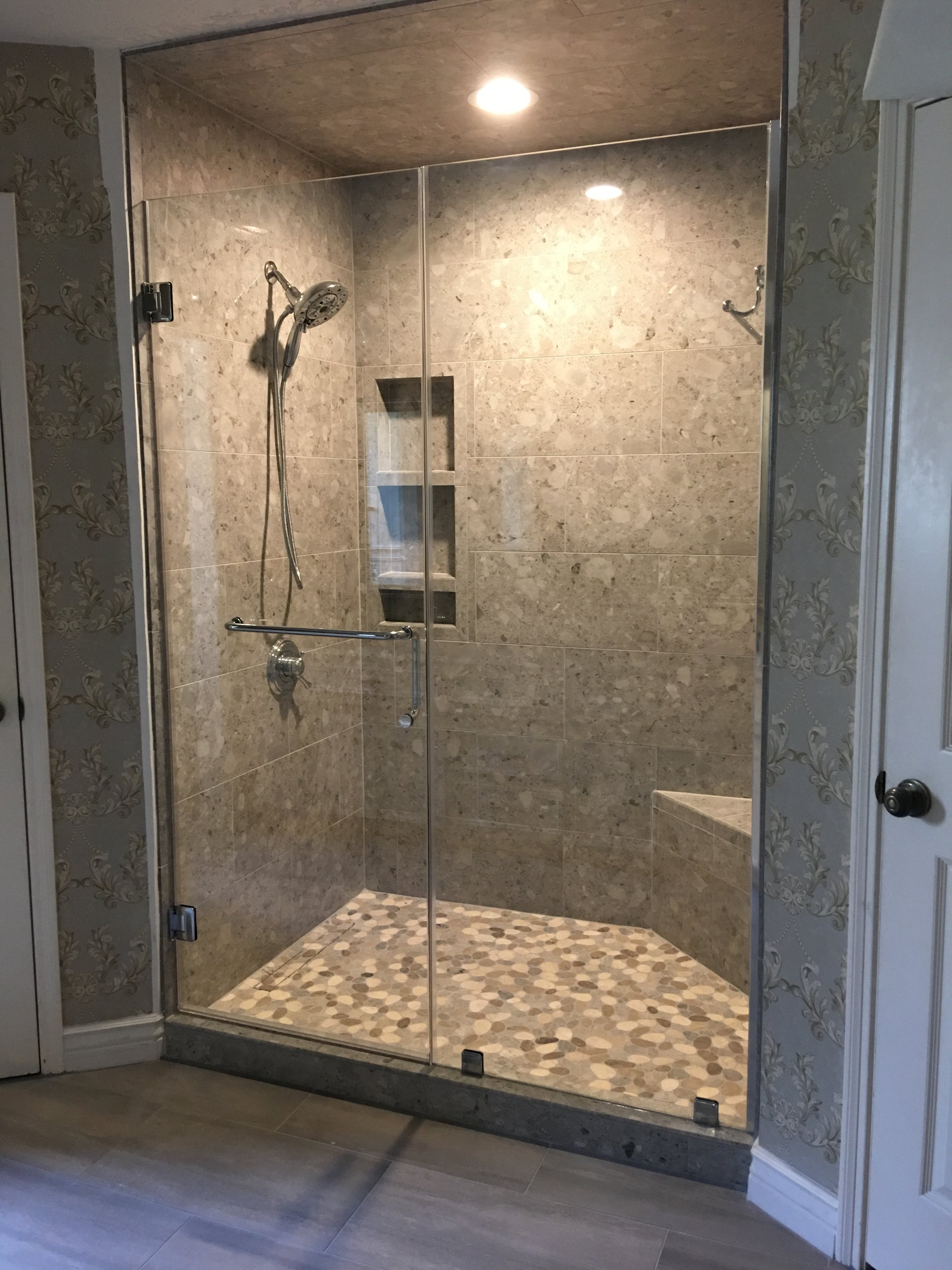 Tiled and glass doored walk in shower