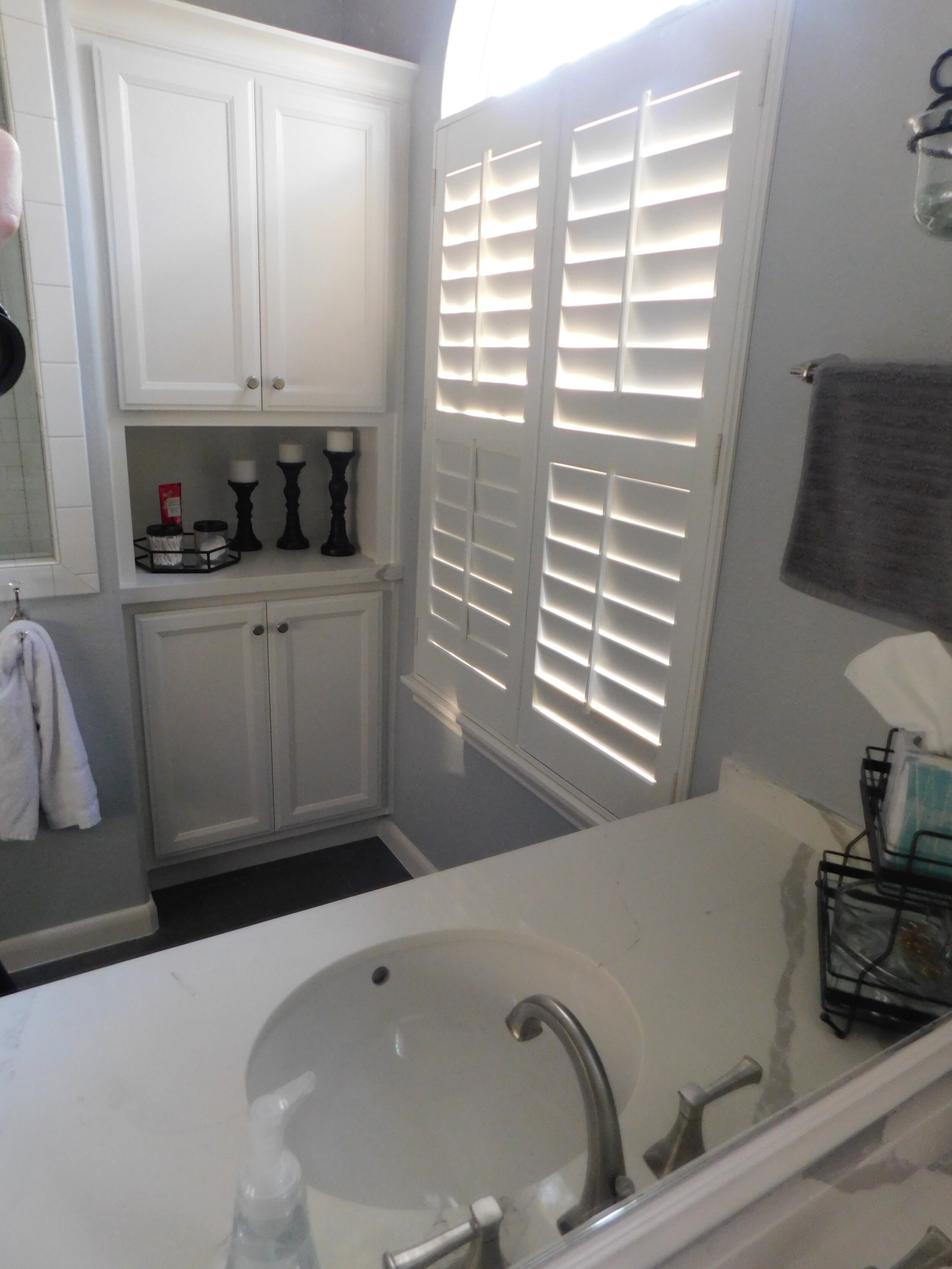 Master Bath Remodel - New built-in linen cabinet to match existing cabinetry.