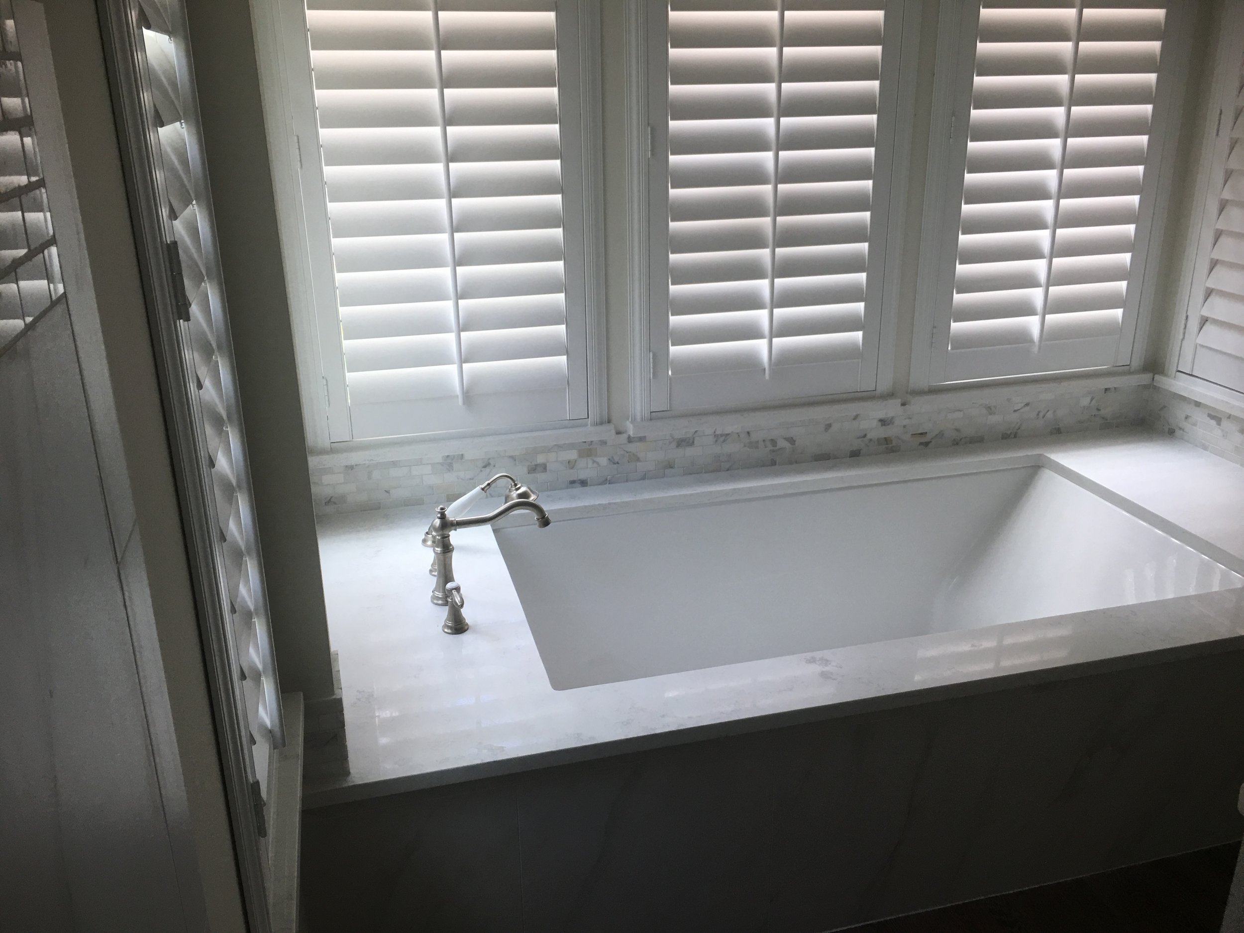 Master Bathroom Renovation Houston - New under mount tub &amp; faucet with granite top and tile backsplash