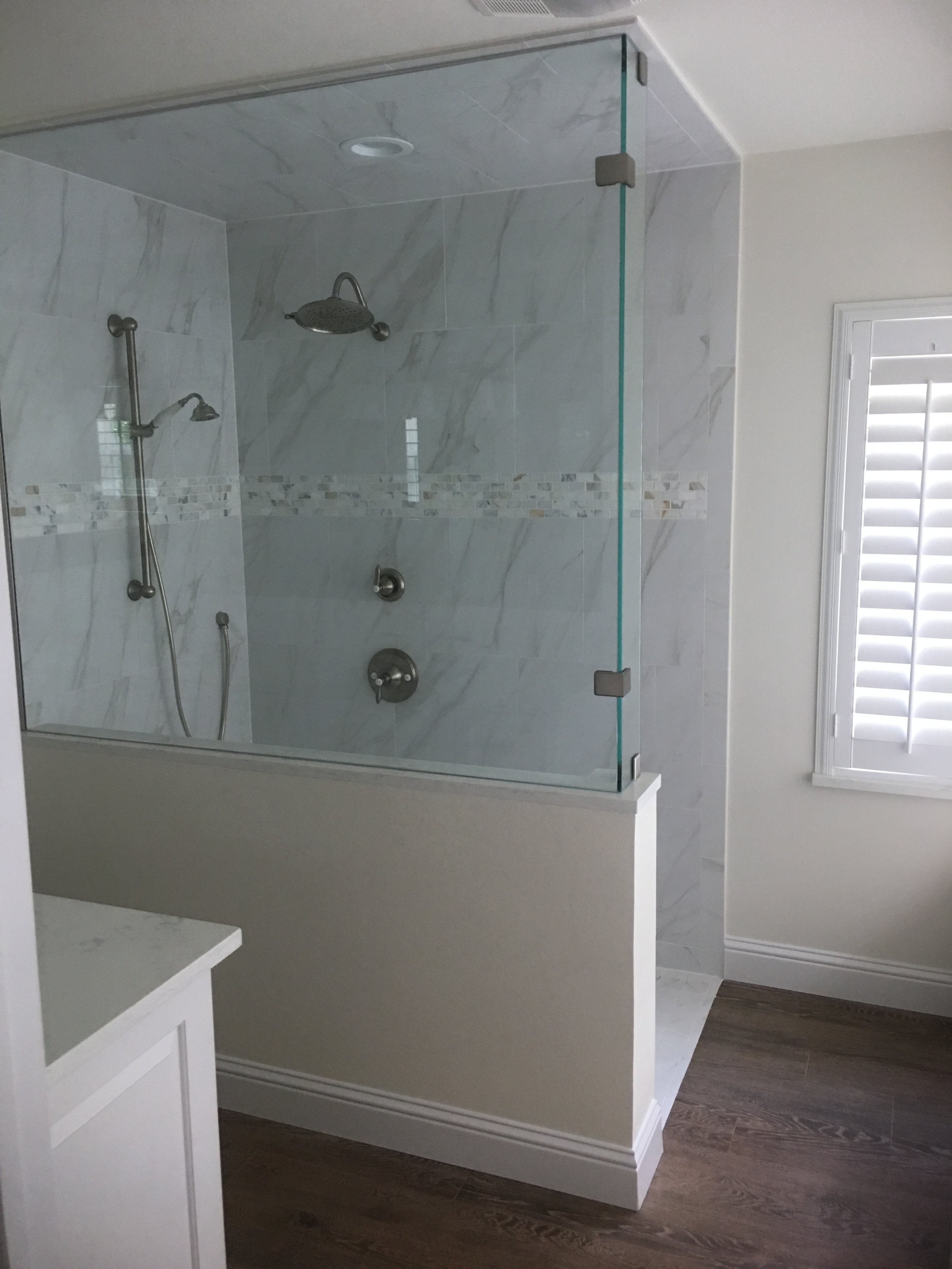 Master Bathroom Remodel Houston - Removed wall for enlarged walk-in shower with frame less glass.  