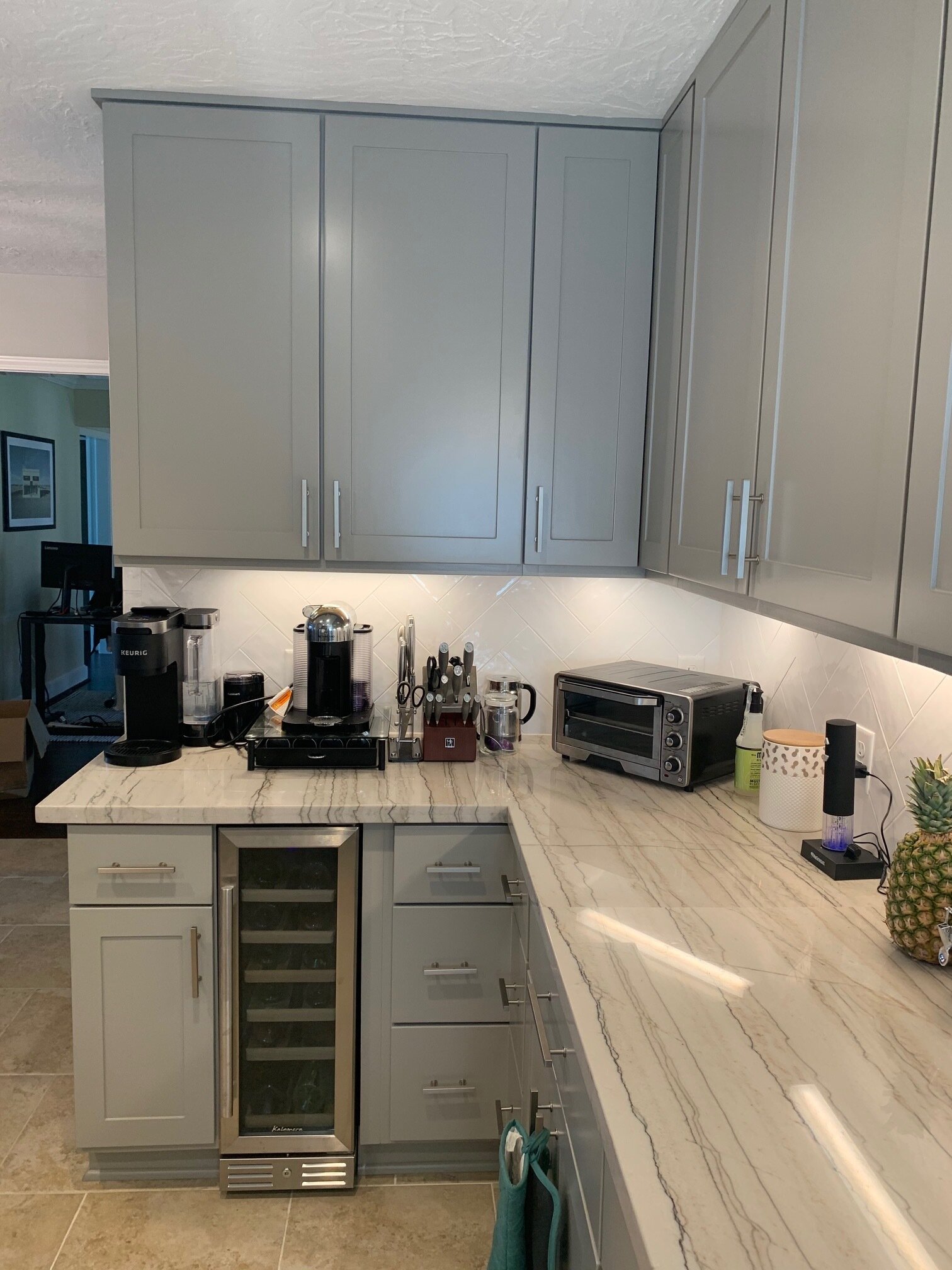 Home Renovation - Removed fur down, extended cabinetry to ceiling, new plumbing, under cabinet lighting, back splash, quartz counter top, and paint