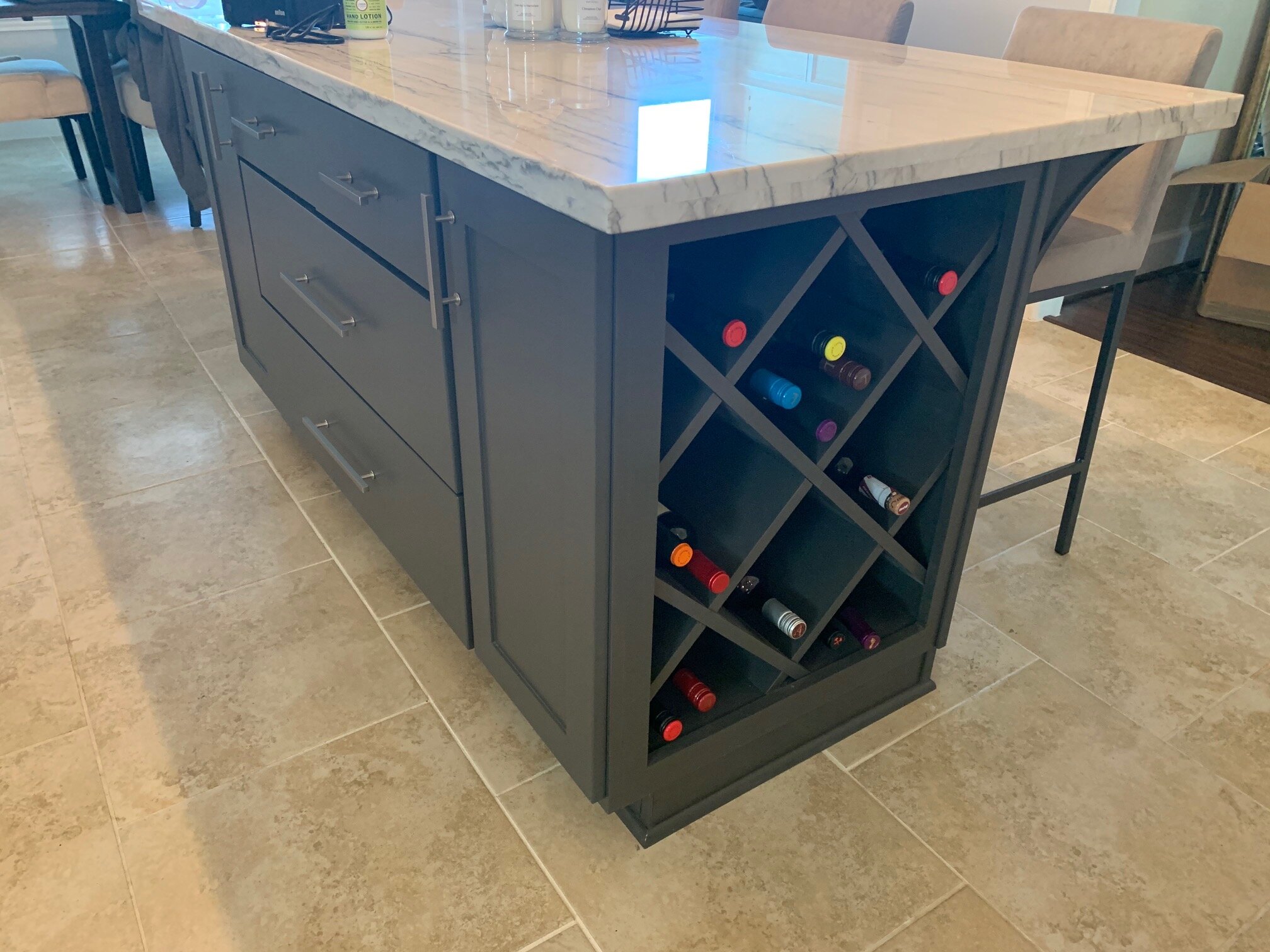 Kitchen Renovation in Spring, TX - Island cabinet with wine storage and quartz countertop.