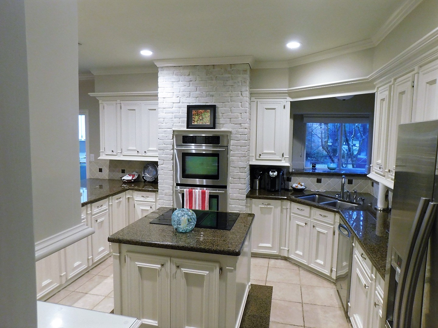 Kitchen Renovation in Spring, TX - Cabinet modifications in Champions Forest (new styles, trash pull out, hinges, and paint)