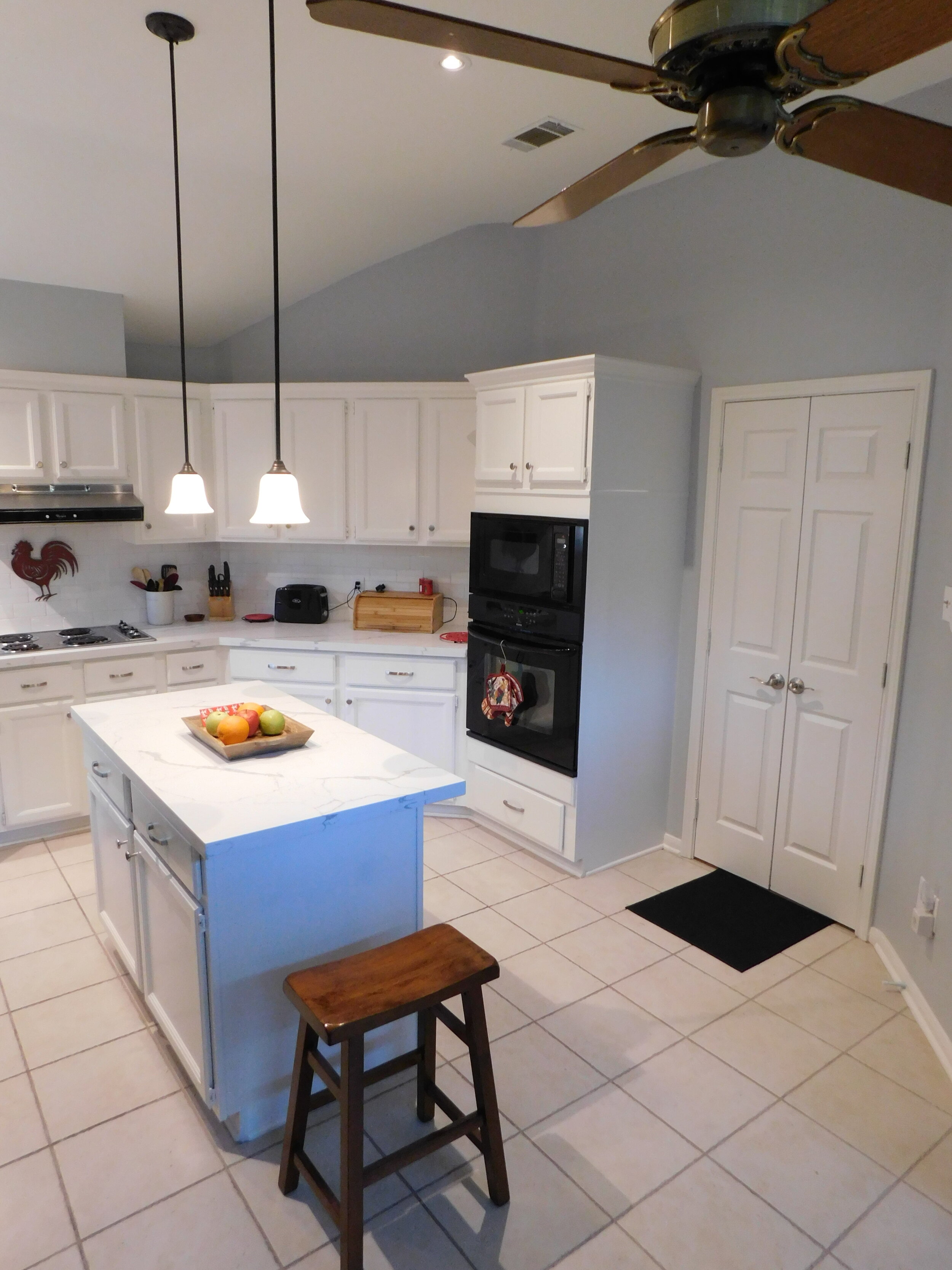 Kitchen Remodel - Updated cabinet faces, new paint, countertops, backsplash, plumbing fixtures, and hardware